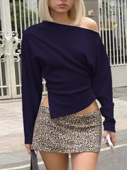 Navy blue draped asymmetrical off-shoulder t-shirt with long sleeves and a casual cut.