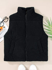 Black corduroy zip-up vest coat with stand-up collar and pockets.