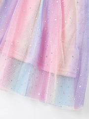 Baby dress with rainbow gradient tulle and glitter detail.