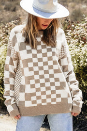 Geometric knit checkerboard pullover sweater in mocha and white with crew neck and long sleeves.