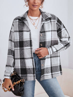 Oversized plaid shacket with button closure in black, white, and gray.