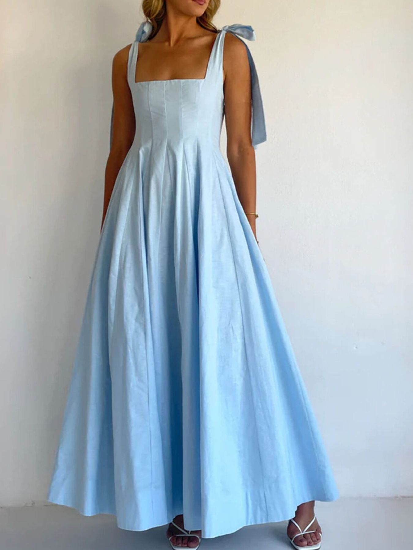 Light blue maxi dress with square neckline and bow tie shoulder straps