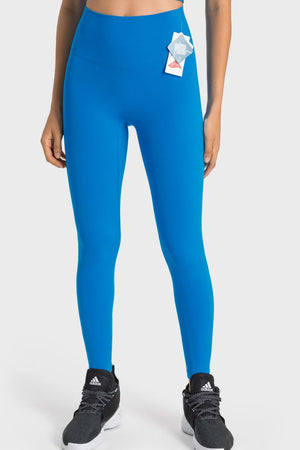 Blue seamless high-waist performance leggings with a tag detail.