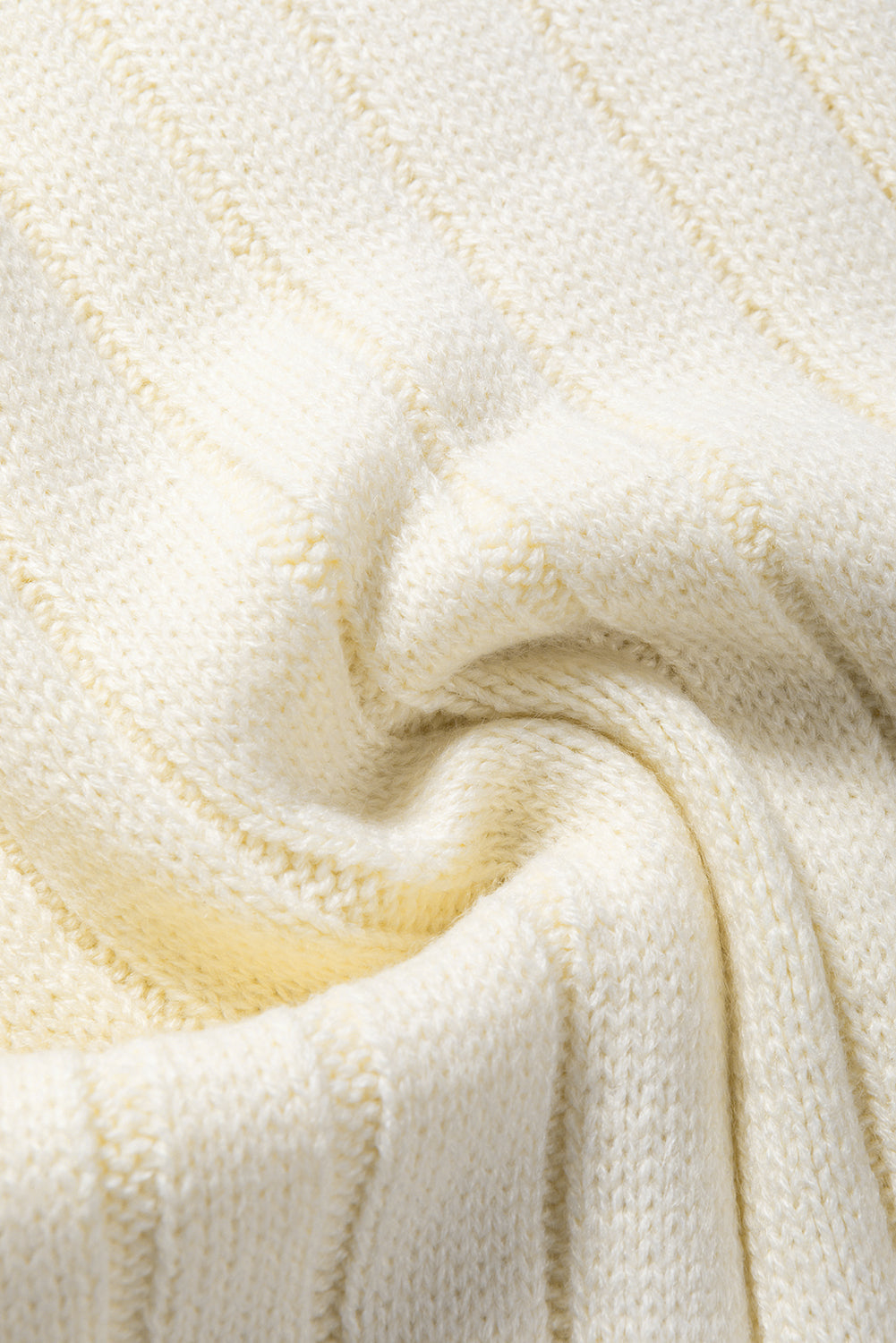 Ivory cable knit mock neck vest with chunky texture and ribbed detail
