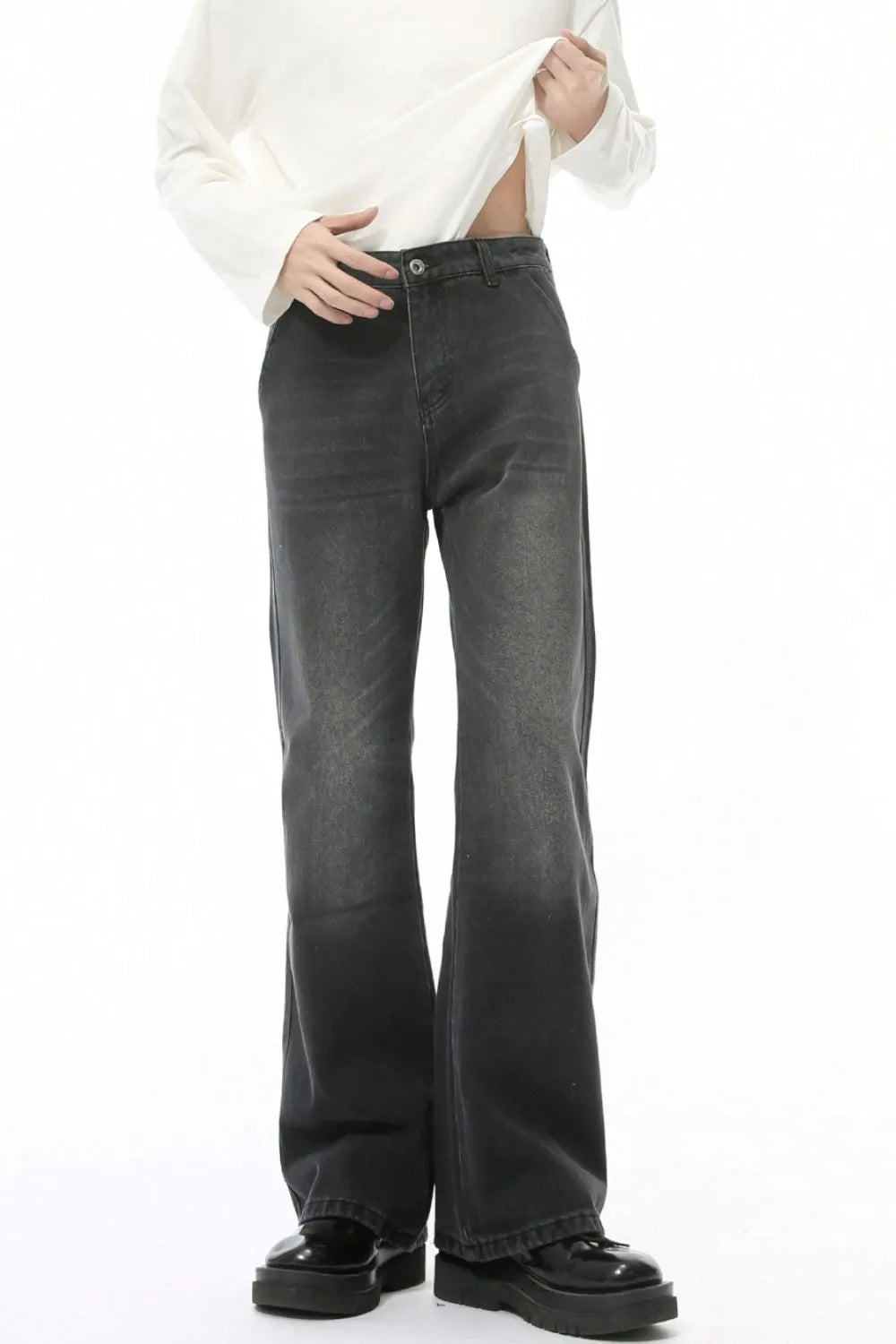 Dark wash wide leg jeans with a high rise and pockets.