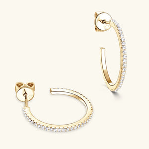 Gold C-hoop earrings with pavé-set stones and butterfly backs