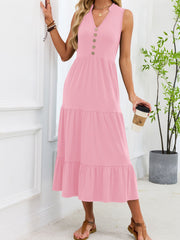 Pink tiered midi dress with notched V-neck and decorative buttons, sleeveless.