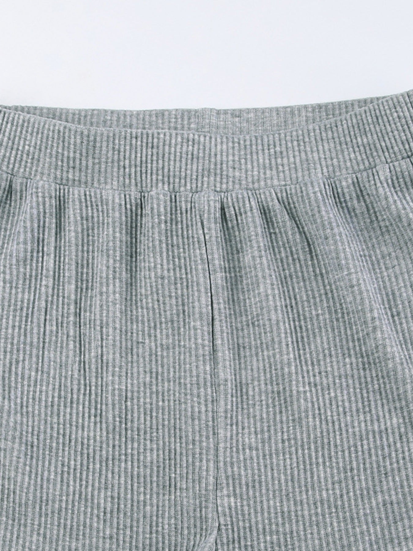 Grey ribbed knit pajama shorts with elastic waistband and drawstring detail