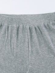 Grey ribbed knit pajama shorts with elastic waistband and drawstring detail