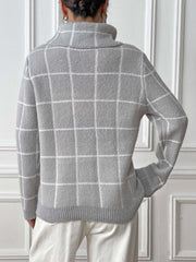Light gray knit turtleneck sweater with white grid pattern and ribbed cuffs.