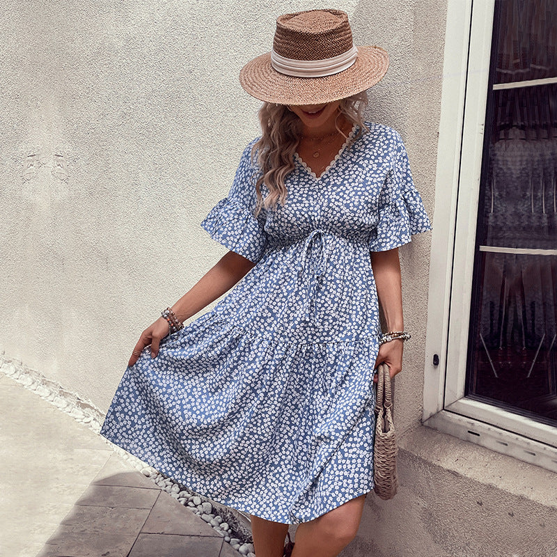 Light blue ditsy floral tiered midi dress with v-neck and flutter sleeves