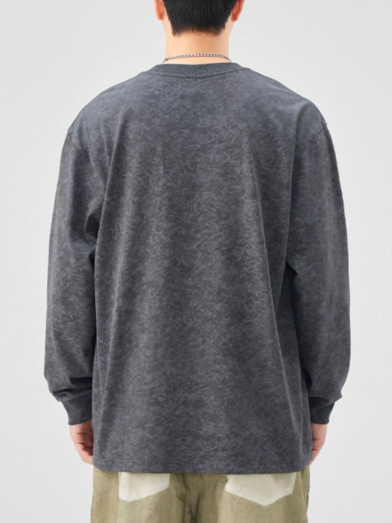 Oversized long-sleeve t-shirt in dark gray with a washed-out effect.