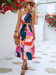 Abstract cutout midi dress with one shoulder and colorful geometric print.