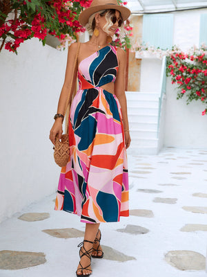 Abstract cutout midi dress with one shoulder and colorful geometric print.