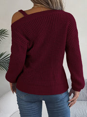 Wine one-shoulder knit sweater with buckle detail and waffle texture.
