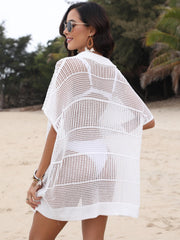 White open-knit polo beach dress with short sleeves and a collar, styled over a bikini.