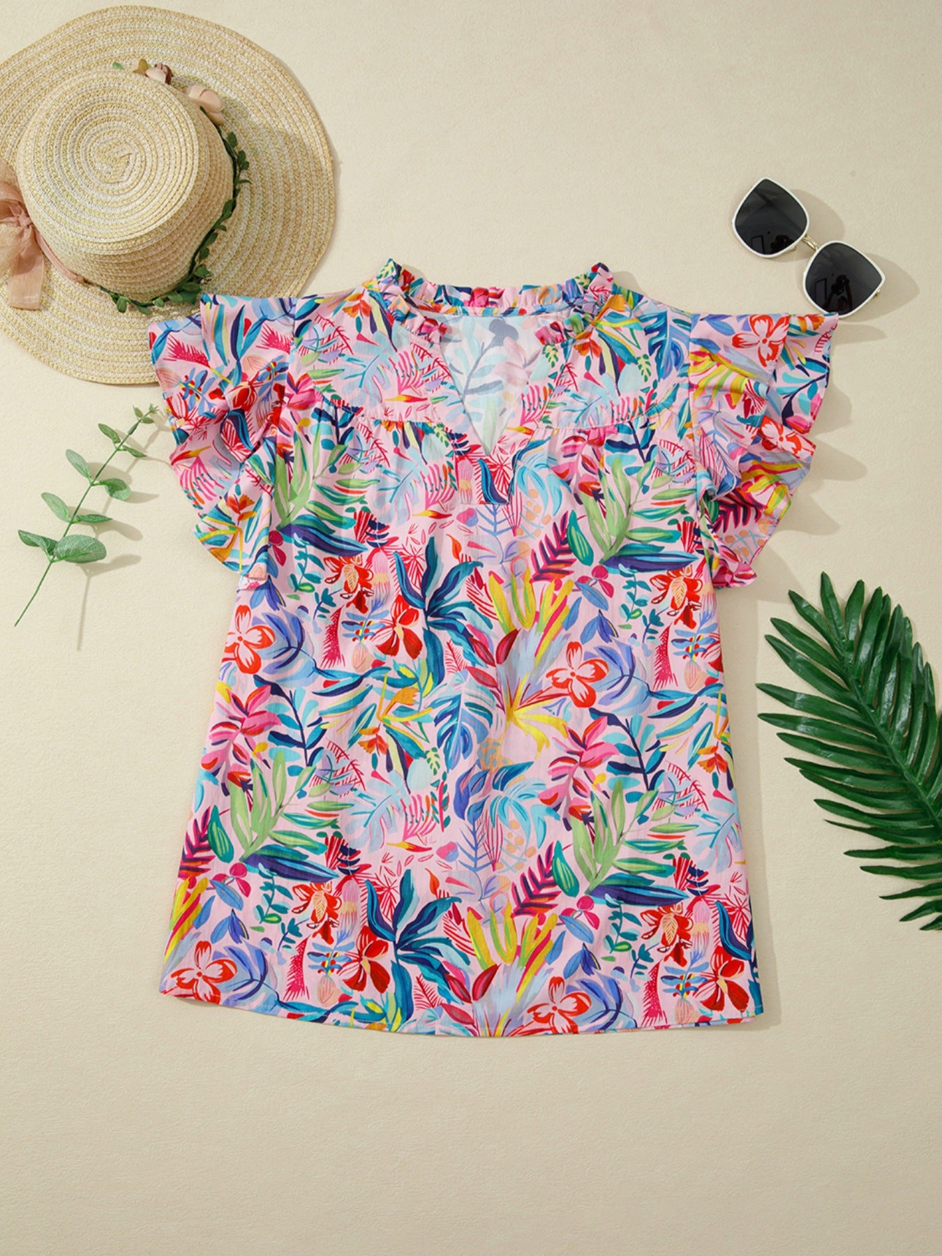 Tropical floral print cotton blouse with ruffled short sleeves and mock neck