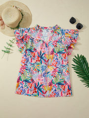 Tropical floral print cotton blouse with ruffled short sleeves and mock neck