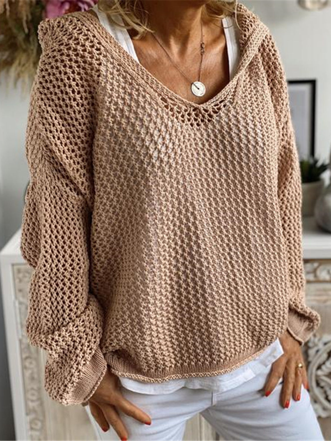 Tan open-knit slouchy hooded sweater with v-neck and relaxed fit.