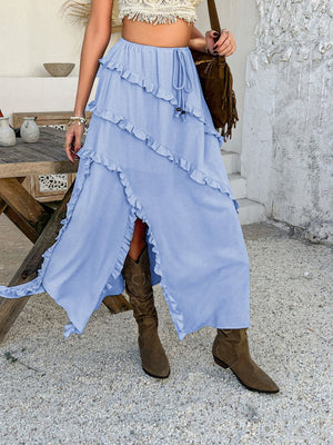 Light blue midi skirt with cascading ruffles and a thigh-high slit.