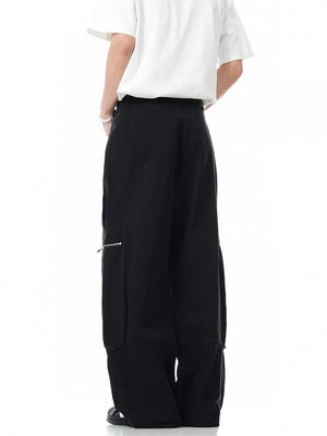 Black men's cargo pants with zippered pocket detail and wide leg.