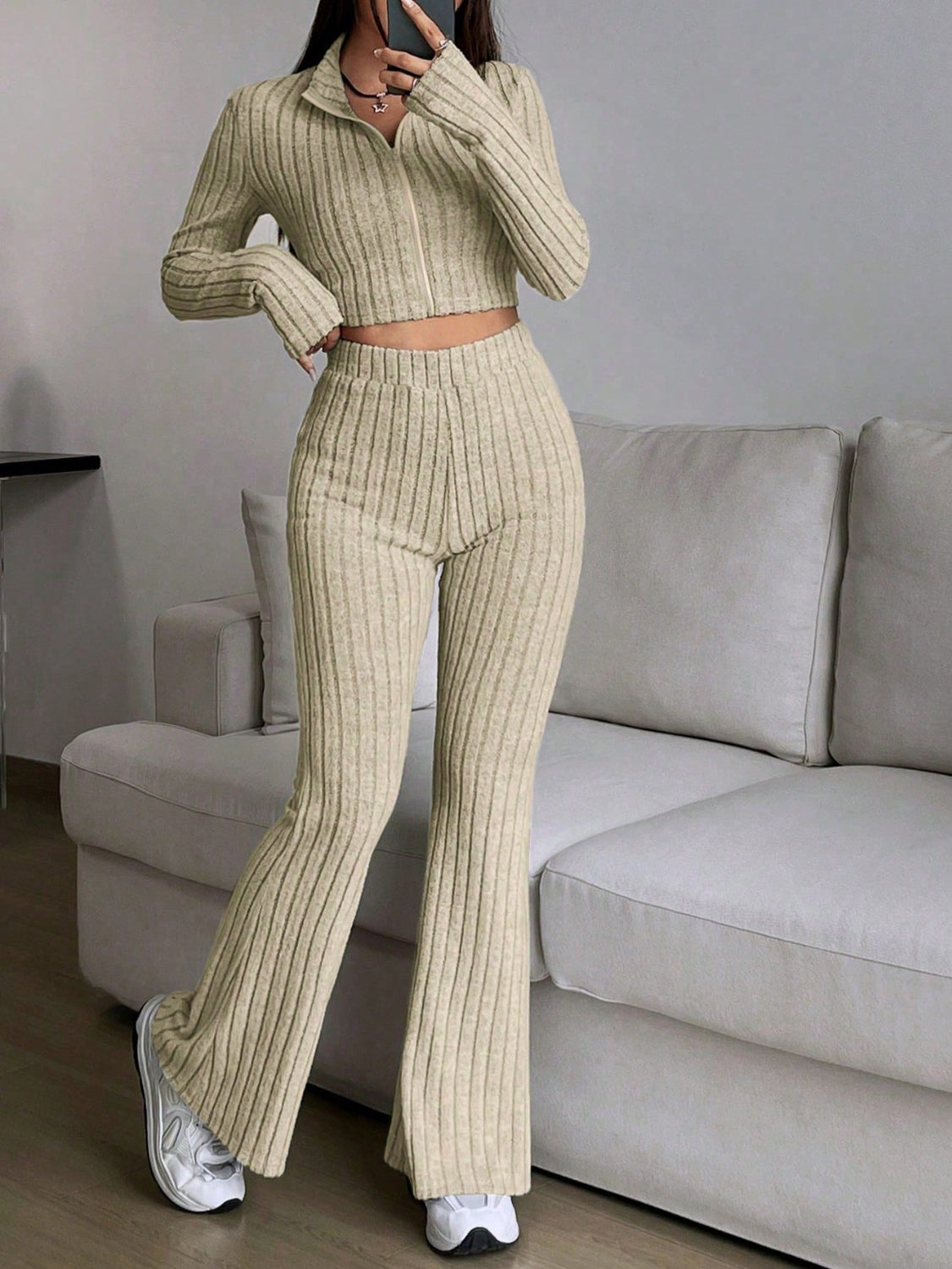 Ribbed knit flare co-ord set in Khaki with zip-neck crop top and high-waisted flared pants.