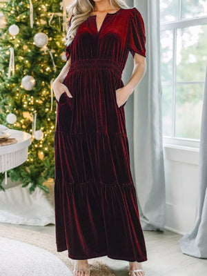 Wine red velvet maxi dress with pockets, tiered skirt, and smocked waist.