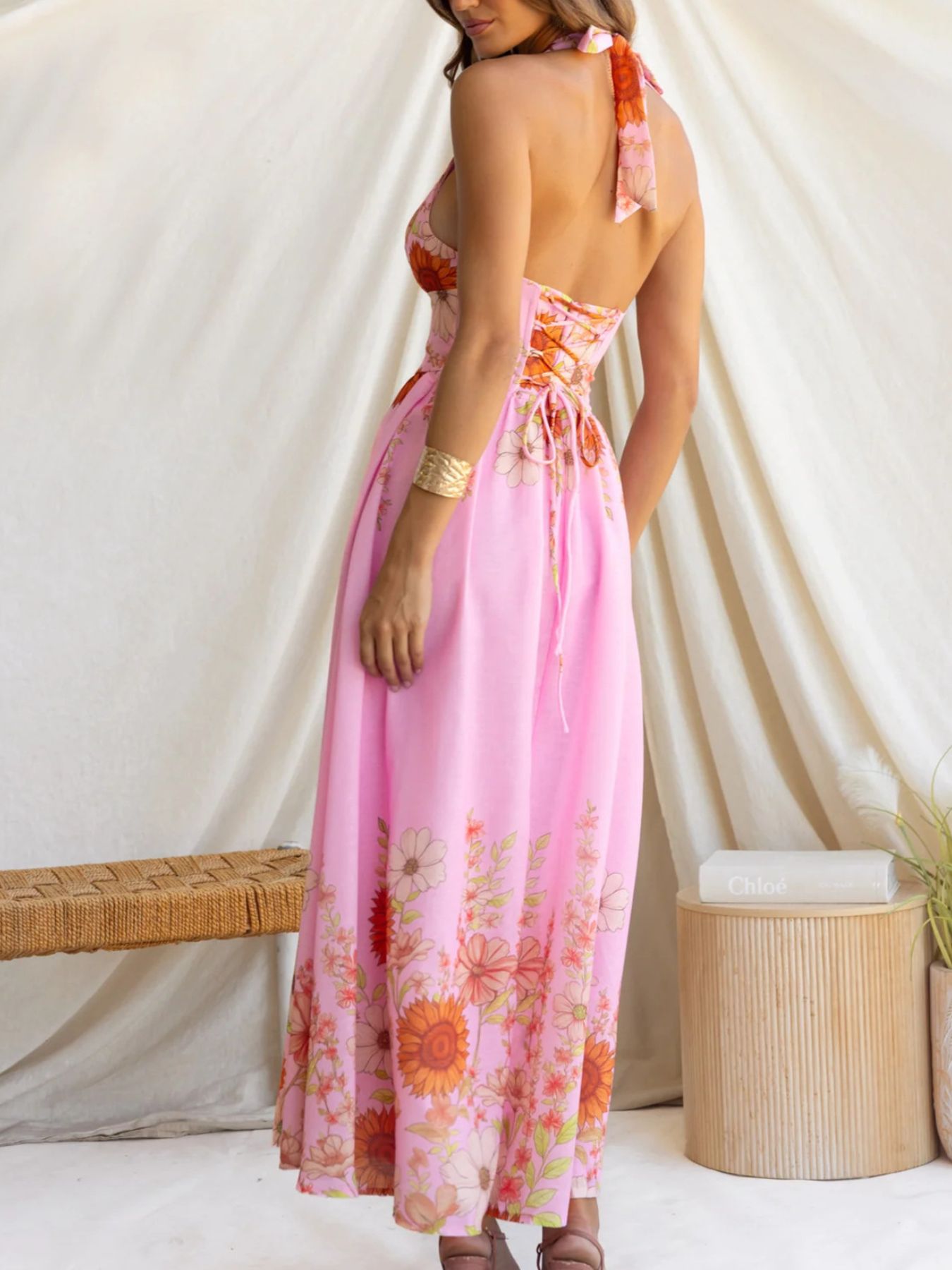 Pink floral halter neck maxi dress with corset back detail