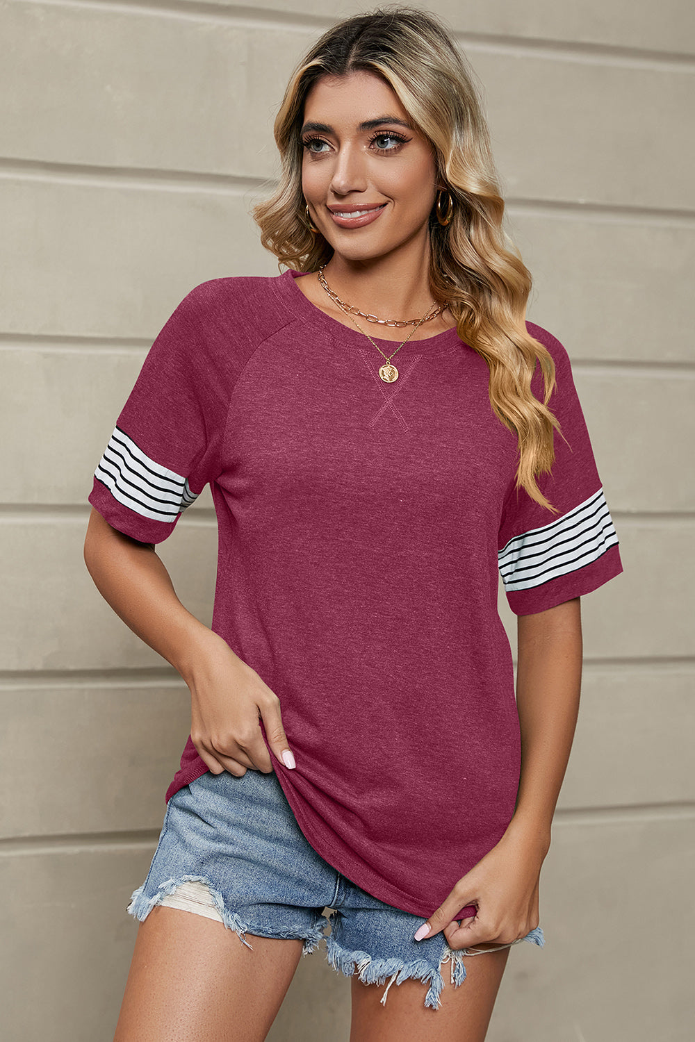 Burgundy raglan sleeve tee with white and black stripes on sleeves
