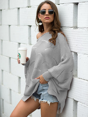 Light gray scalloped knit boat neck sweater with balloon sleeves and open knit detail.