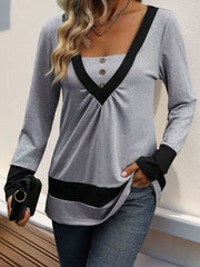 Gray long sleeve top with contrast black V-neck panel and button detail