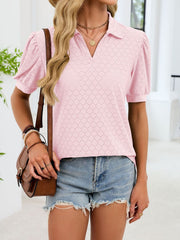 Pink eyelet collar top with puff sleeves and v-neck, styled with denim shorts.