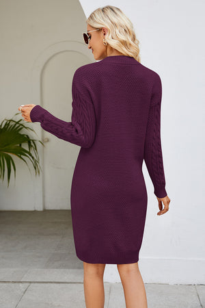 Cable knit bodycon mini dress in magenta with cable sleeves.