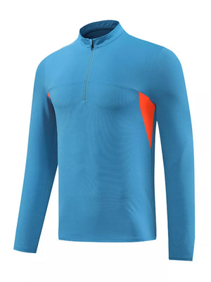 Men's blue long sleeve activewear tee with quarter zip and orange accents.