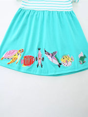 Aqua marine cotton dress with white stripes and embroidered sea life details.