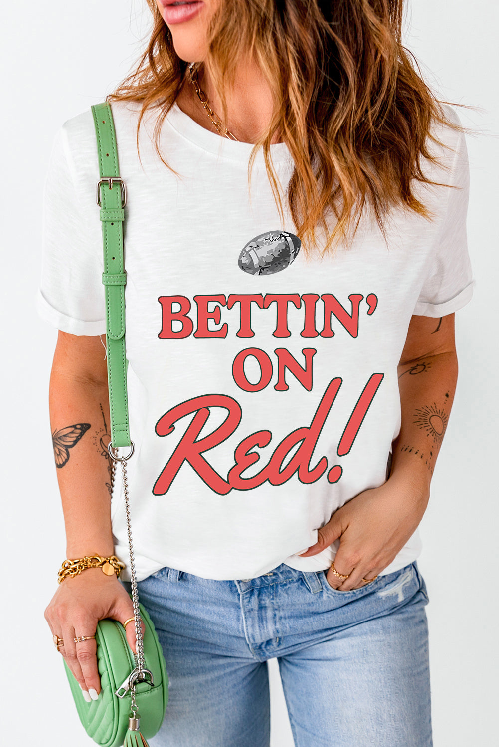White graphic tee with red "Bettin' On Red!" text and football graphic.