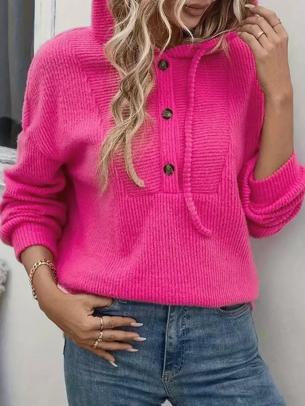 Fuchsia pink button-front hoodie with drawstring and textured knit.