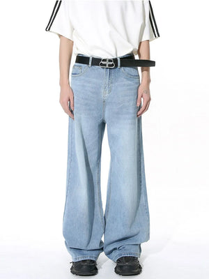 Light blue wide-leg denim jeans with vintage wash and a relaxed fit.