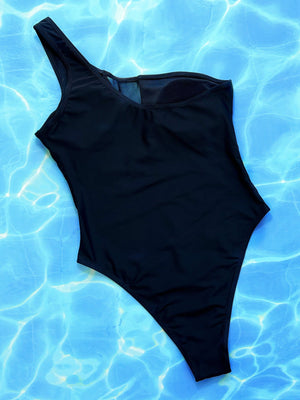 Black one-piece swimsuit with asymmetrical mesh panel detail and one shoulder strap.