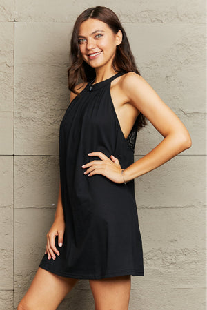 Black halter mini dress with lace back detail and a casual A-line cut.