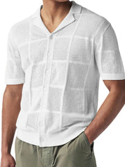 Ivory geometric knit polo shirt with open weave and button front.