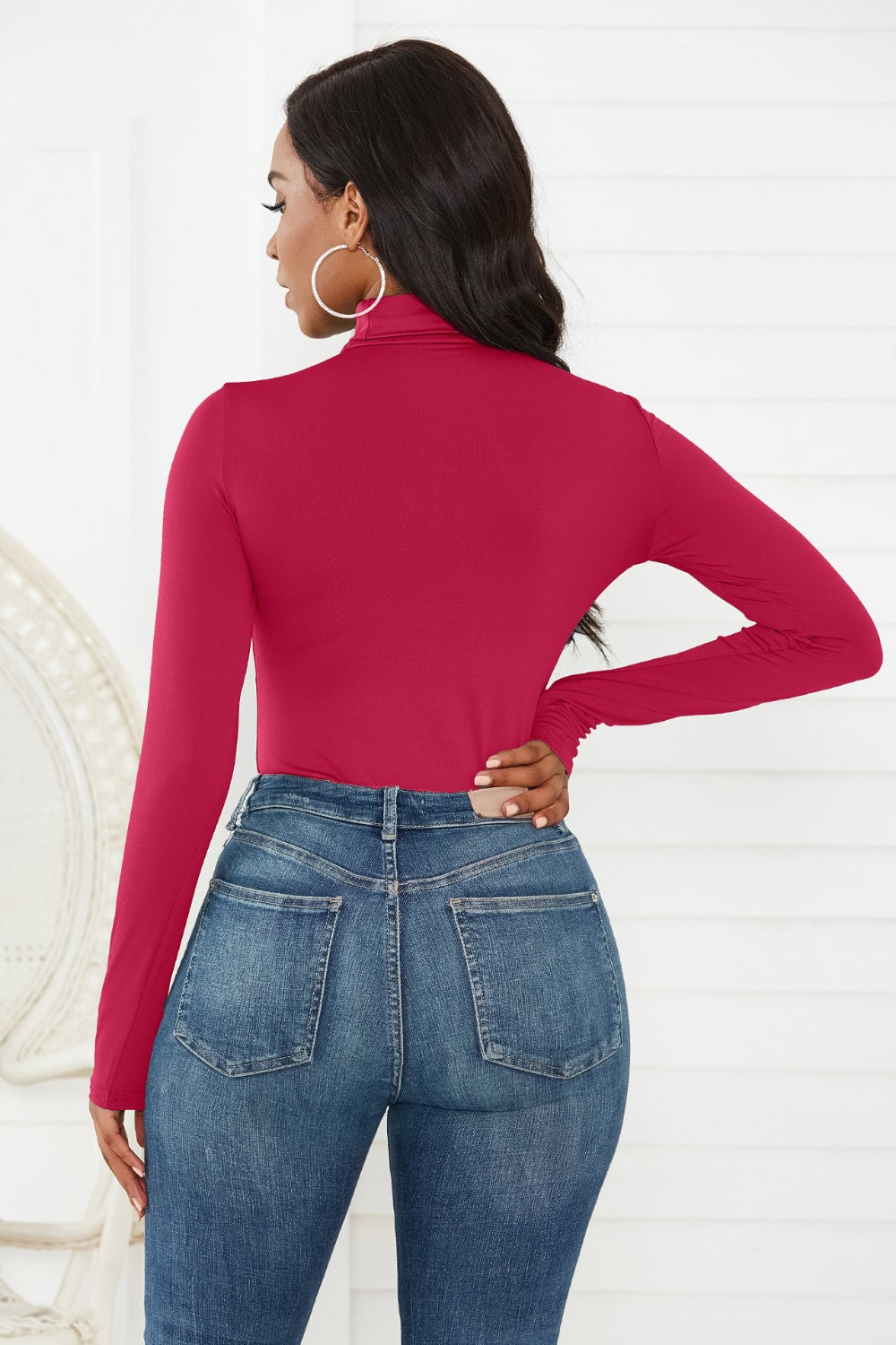 Burgundy turtleneck thong bodysuit with long sleeves, styled with denim jeans.