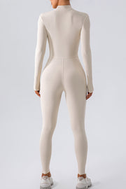 Sculpted zip-front bodycon jumpsuit in white with long sleeves and a high neckline.