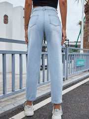 Light wash denim jeans with high rise and pleated front detail.