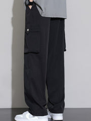 Men's black relaxed fit cargo sweatpants with snap-button pocket detail.