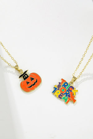 Spooky Season enamel pendant necklaces featuring a jack-o-lantern and "Trick or Treat" text.