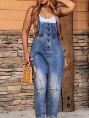 Denim overalls with button-front and adjustable straps in dirty blue wash.
