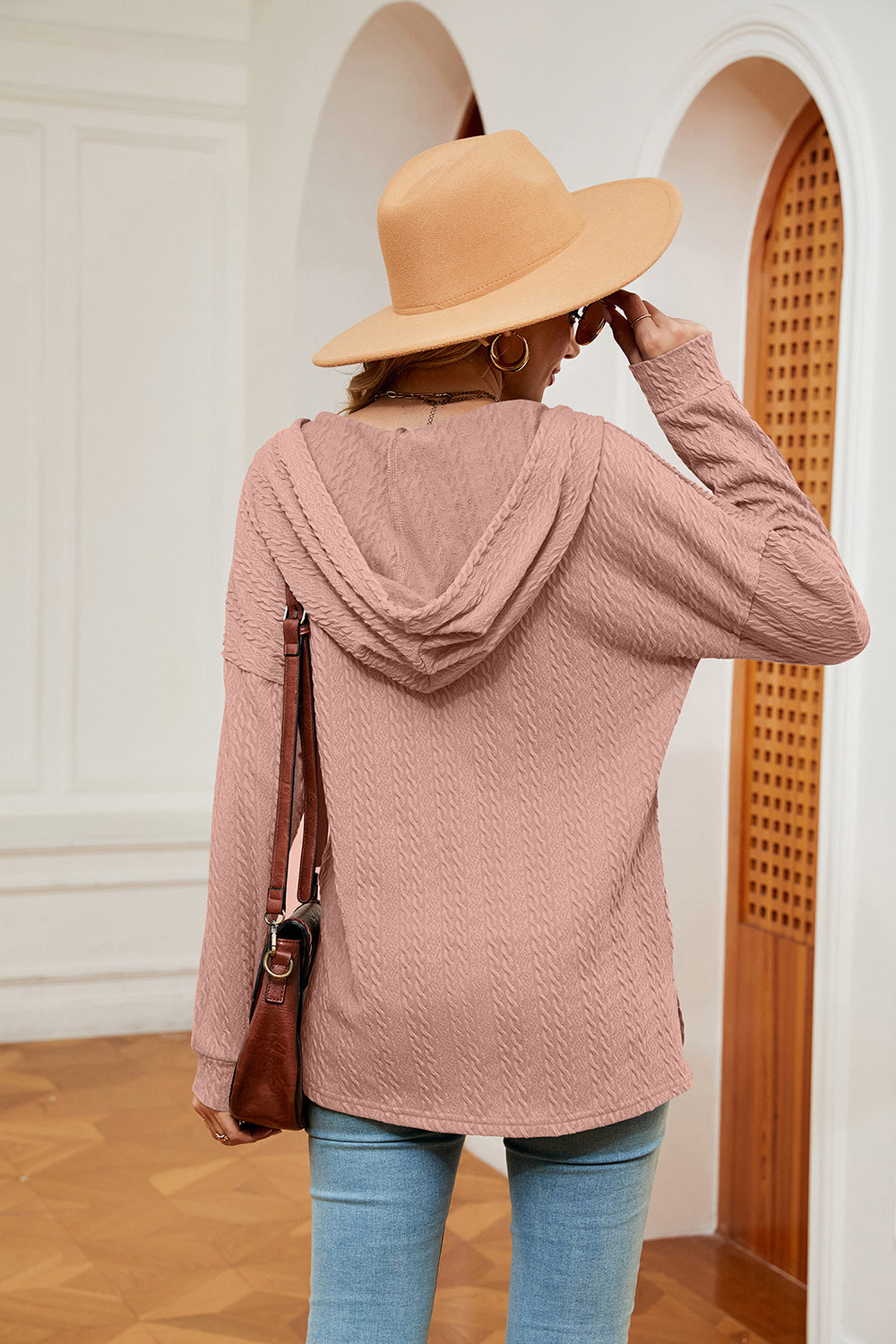 Textured henley hoodie in coral with drop shoulder and long sleeves.