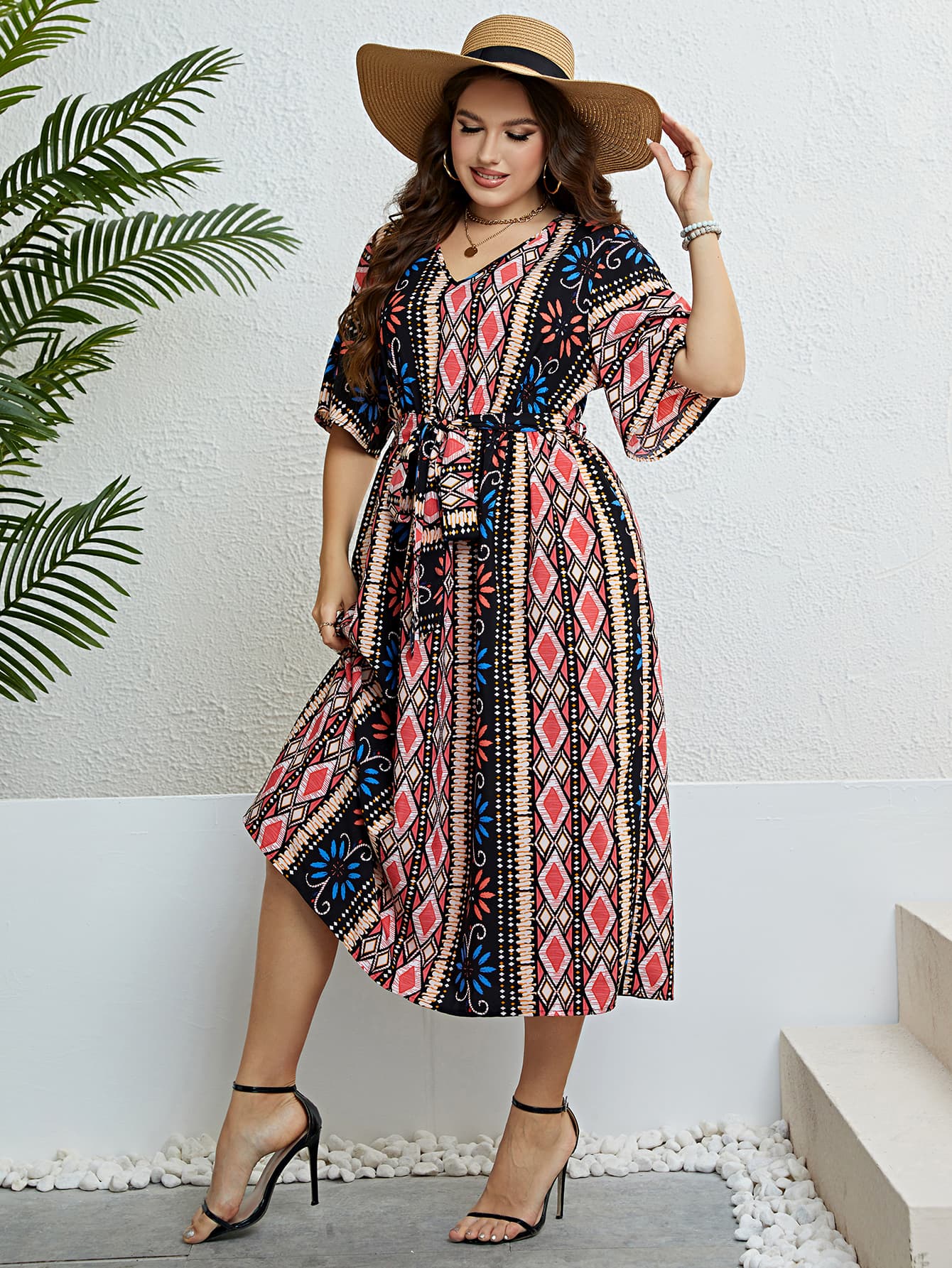 Midi dress with geometric print, V-neck, short sleeves, and tie-waist in multicolor.
