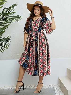 Midi dress with geometric print, V-neck, short sleeves, and tie-waist in multicolor.